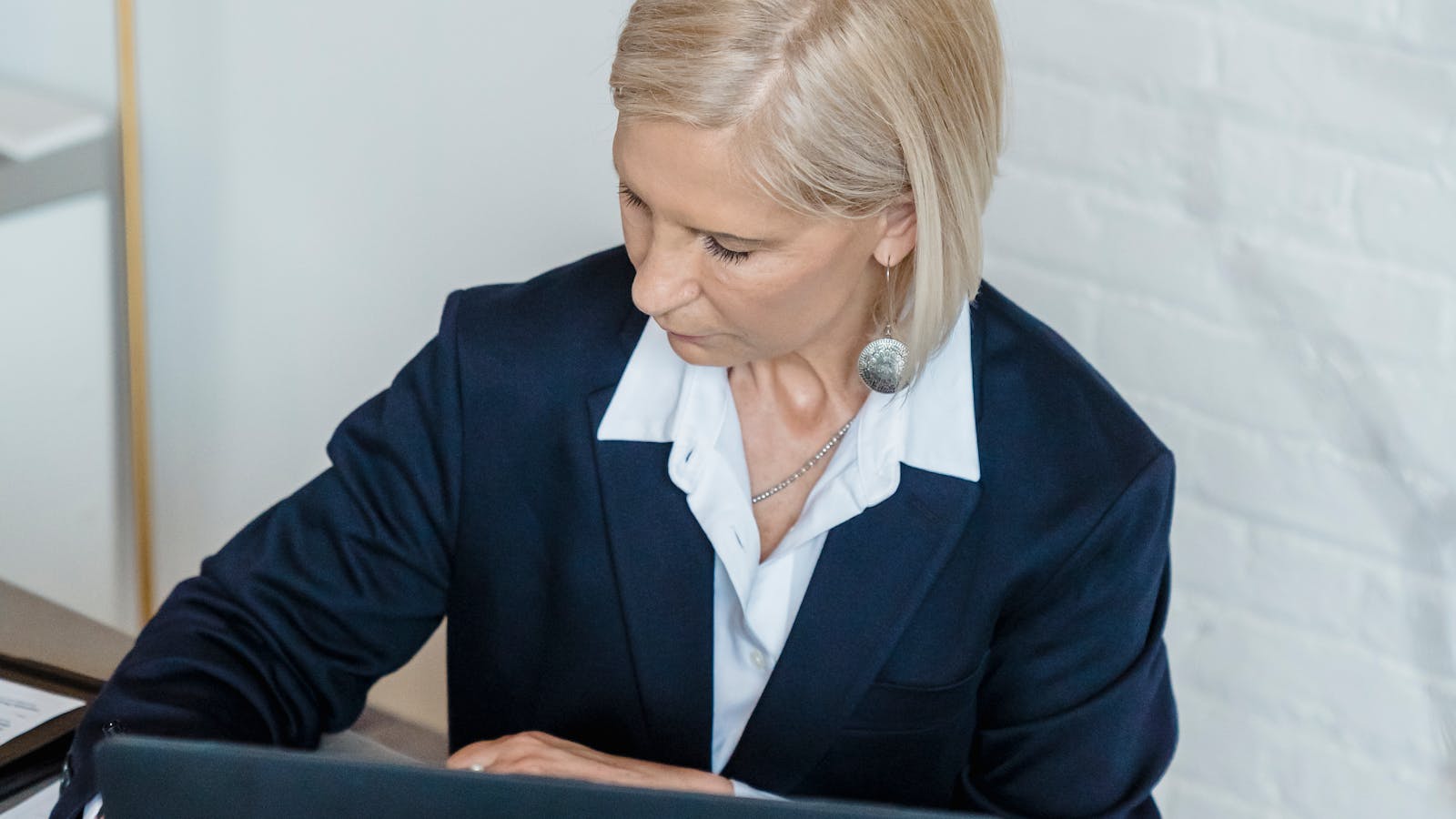 A professional working in a bright modern office setting.