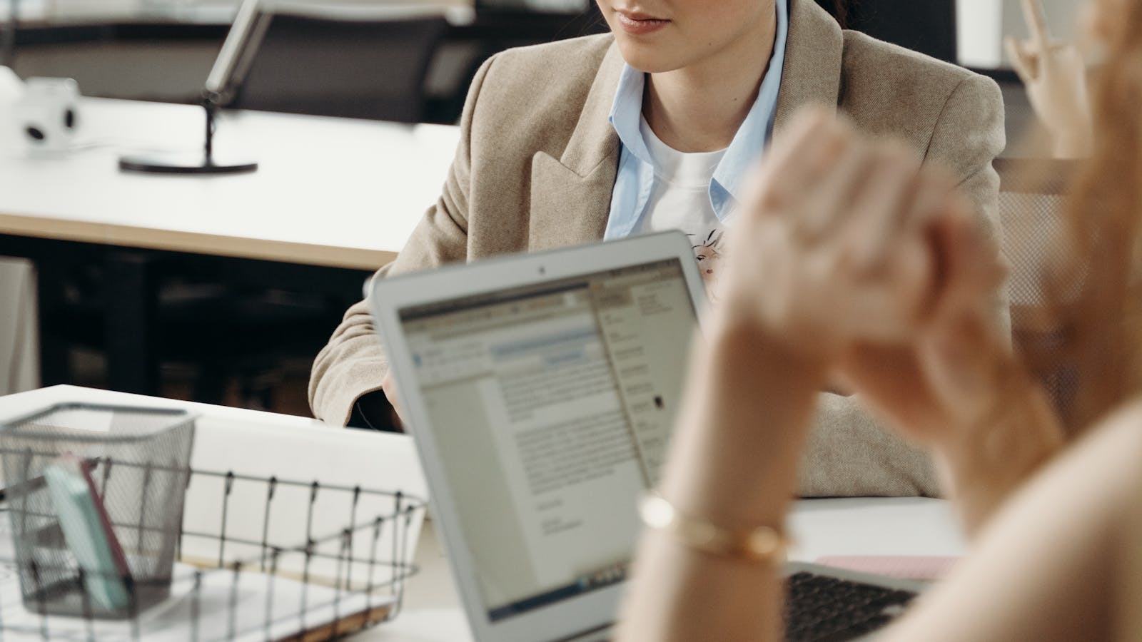 A professional working in a bright modern office setting.