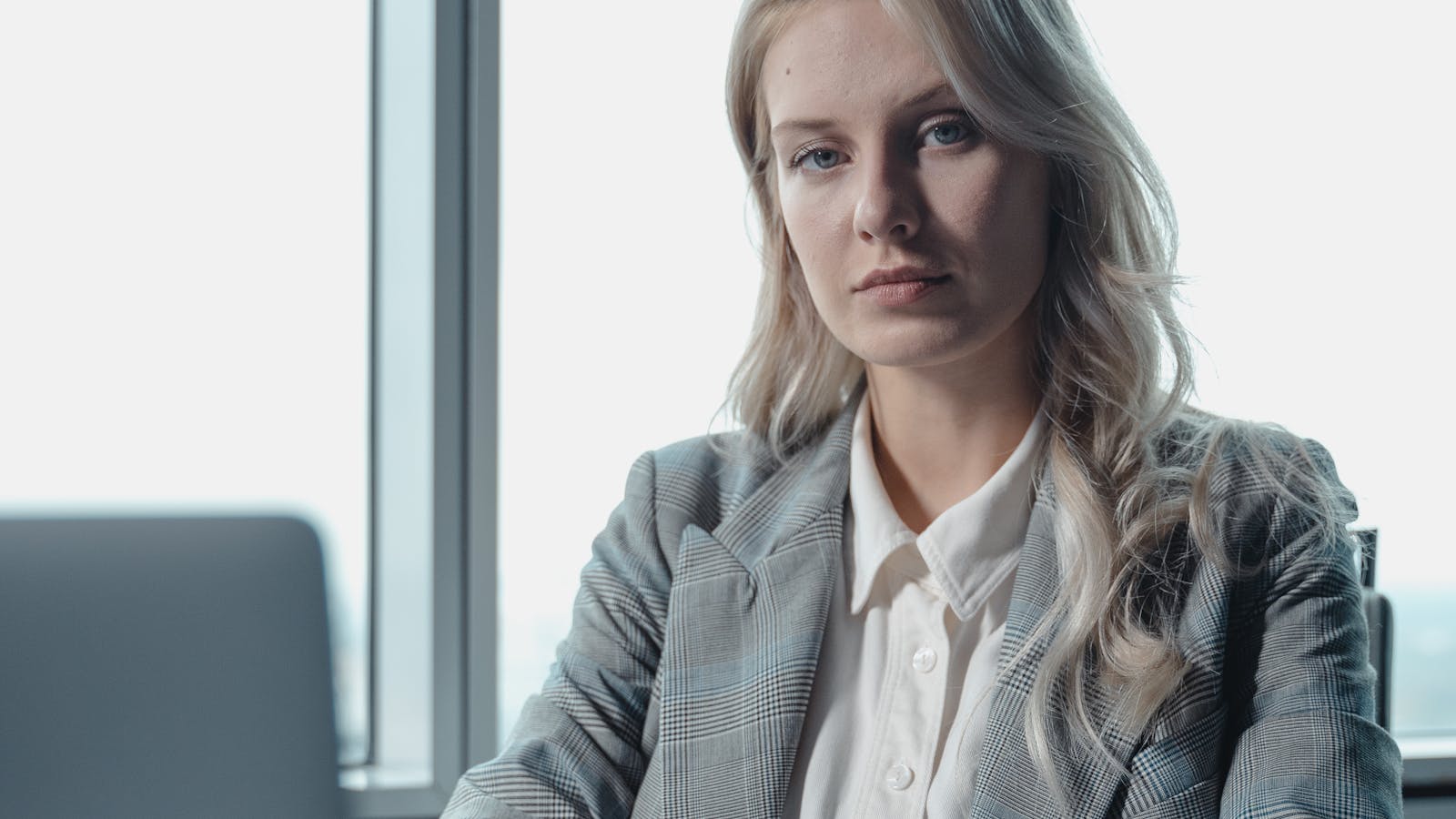 A professional working in a bright modern office setting.