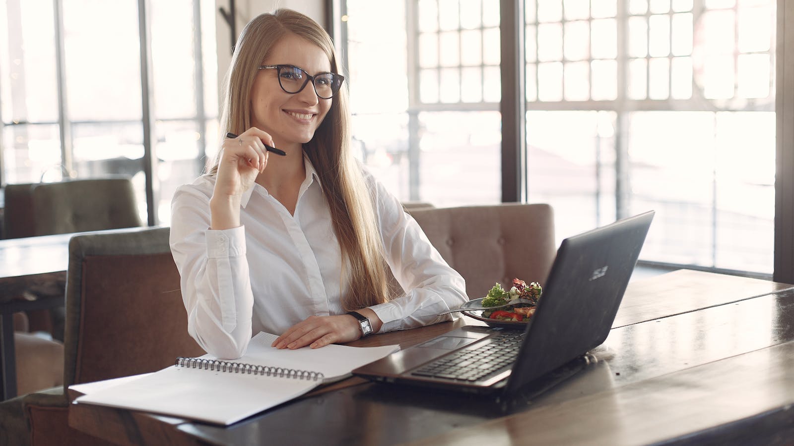 A professional working in a bright modern office setting.