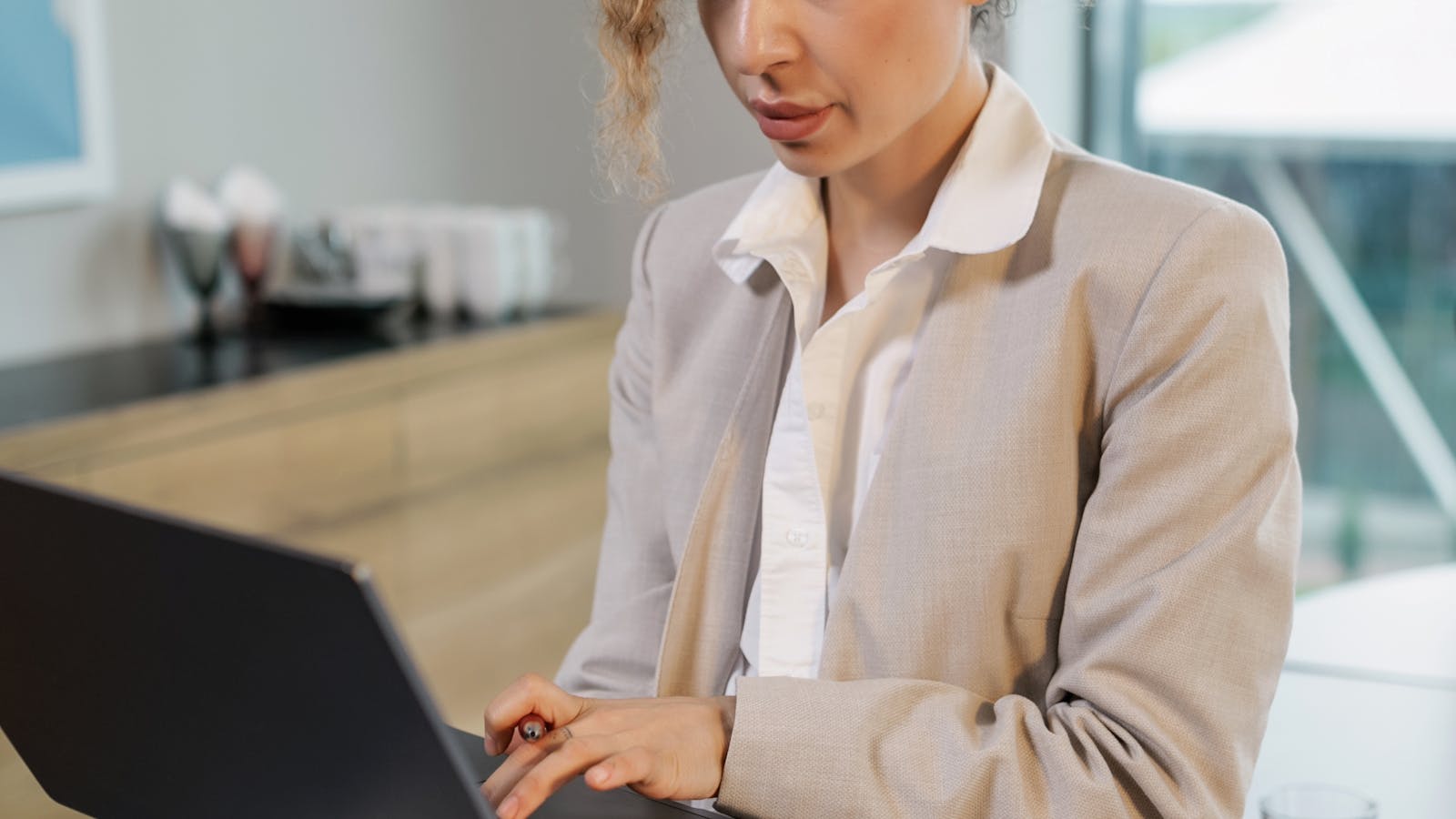 A professional working in a bright modern office setting.