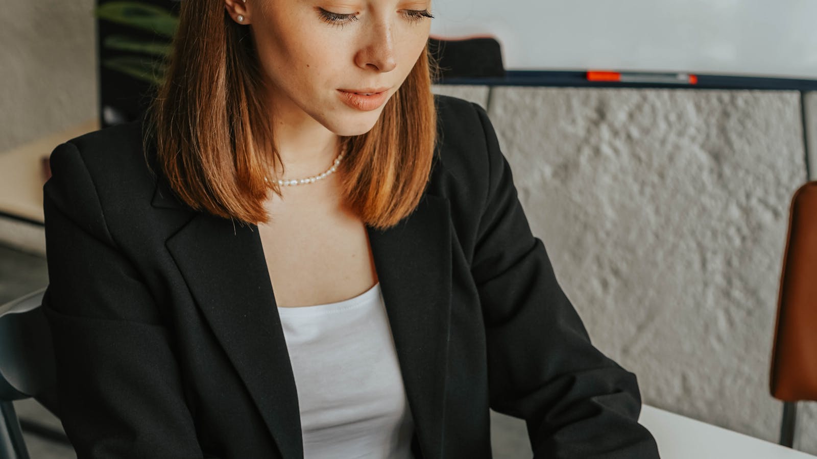 A professional working in a bright modern office setting.