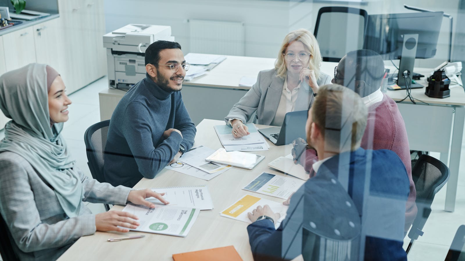 A professional working in a bright modern office setting.