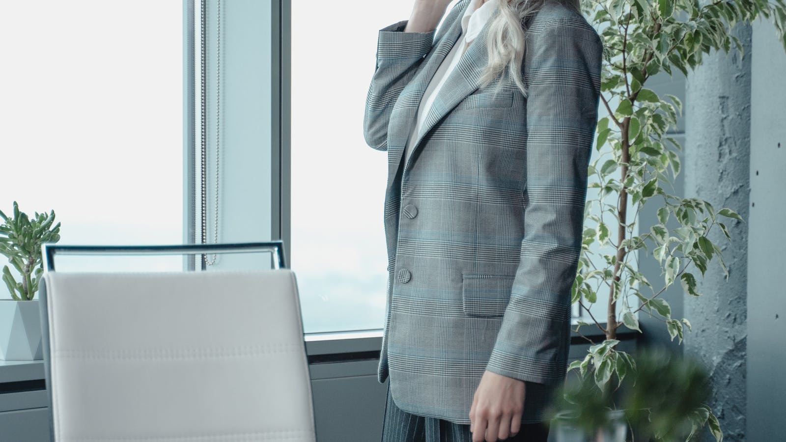 A professional working in a bright modern office setting.